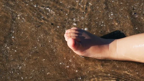 A baby playing on the beach Video stock 123386104