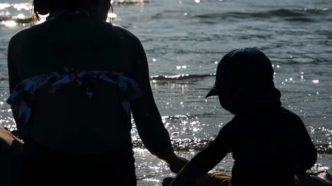 A baby playing on the beach Video stock 123386211