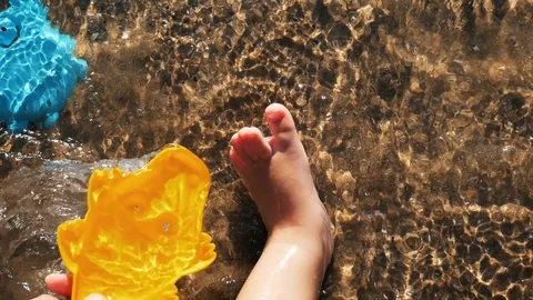A baby playing on the beach Video stock 123386445