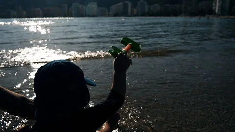 A baby playing on the beach Video stock 123386486