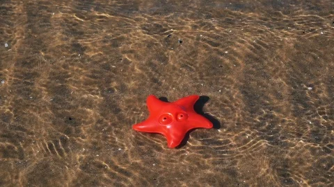A baby playing on the beach Video stock 123386597