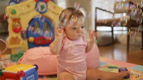 Baby Playing with Bubbles Stock Footage 91330773