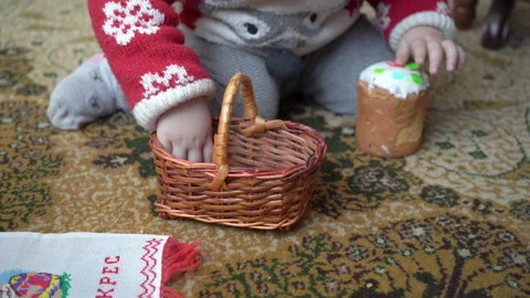 A baby is playing with an Easter basket Stock Footage 235715851