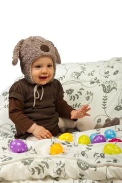 Baby playing with Easter egss Foto stock