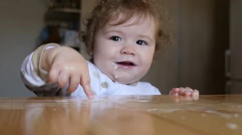 Baby playing with flour Stock Footage 49949662