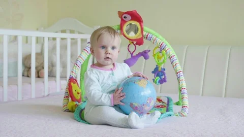 Baby playing with globe Stock Footage 103386724