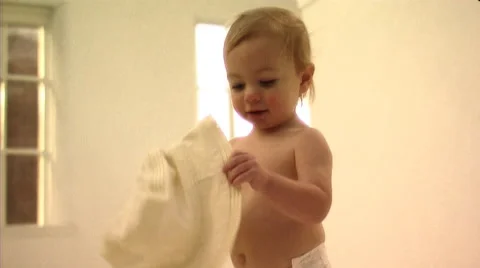 Baby playing with hat Stock Footage 43695926