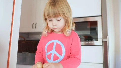 Baby playing in the kitchen Stock Footage 69800686