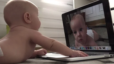 Baby playing with a laptop Stock Footage 95948997