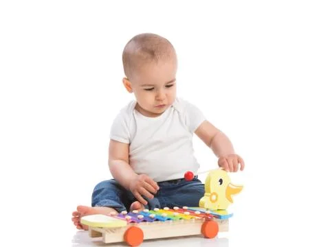 Baby playing percussion Stock Photos