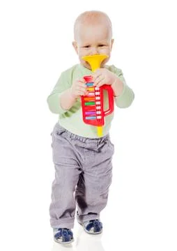 Baby playing pipe Foto stock