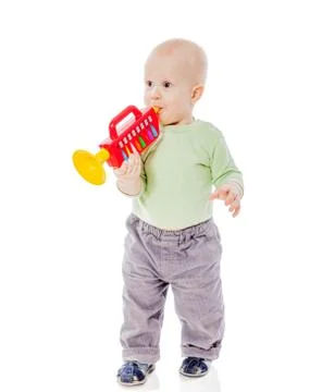 Baby playing pipe Foto stock