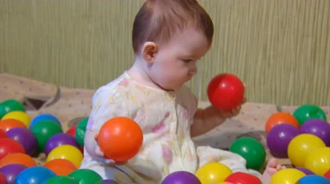 Baby playing with plastic balls Stock Footage 975830
