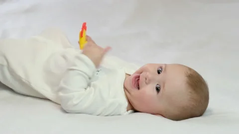 Baby is playing a rattle. selective focus Stock Footage 146859129