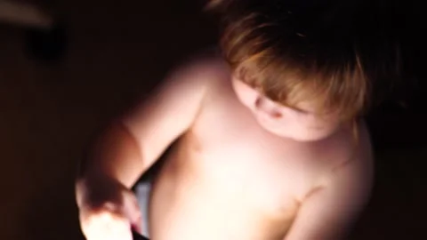 Baby playing with ring light Stock Footage 138729553