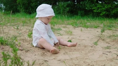 Baby playing with sand Stock Footage 78533825