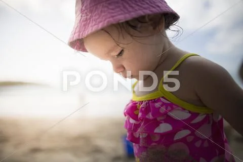 Baby Playing On Sandy Beach