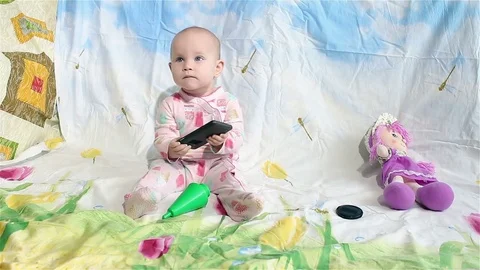 Baby playing with a smartphone Stock-Footage 72839766