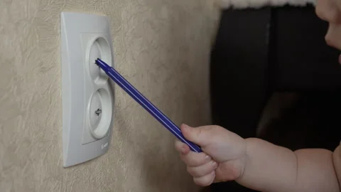Baby playing with a socket Stock Footage 275354252