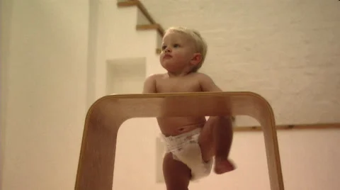 Baby playing with stool Stock Footage 43695669