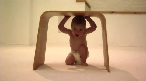Baby playing with stool Stock Footage 43695740