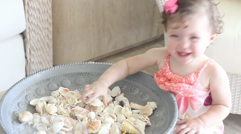 Baby playing with table decorations Stock Footage 1071288