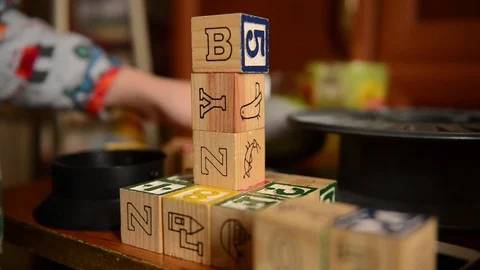 Baby playing with wooden developing dices Stock Footage 71533003