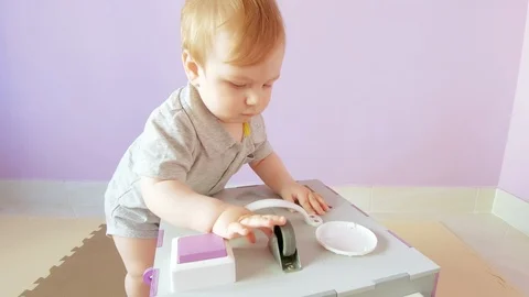 Baby plays with busy cube Stock Footage 109377322