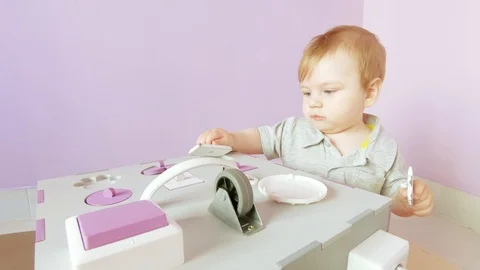Baby plays with busy cube Stock Footage 109933983