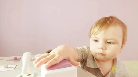 Baby plays with busy cube Stock Footage 114634909
