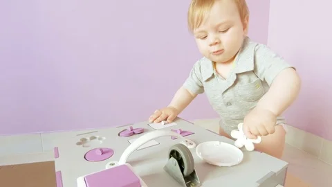 Baby plays with busy cube Stock Footage 120183642