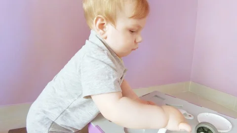 Baby plays with busy cube Stock Footage 122844559