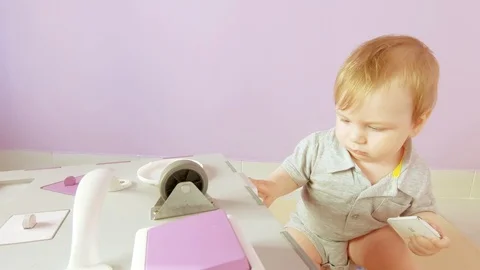 Baby plays with busy cube Stock Footage 127023905