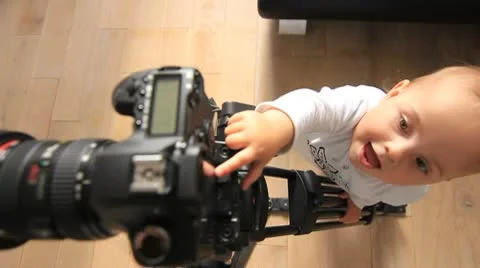 Baby plays with camera. Stock Footage 8852036