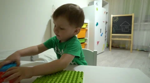 Baby plays the designer Stock Footage 62776547