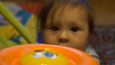 Baby plays with a developing toy Stock Footage 124837138