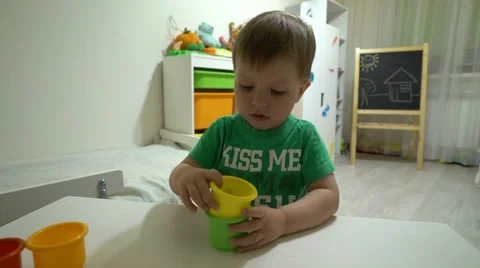 Baby plays jars Stock Footage 62776552