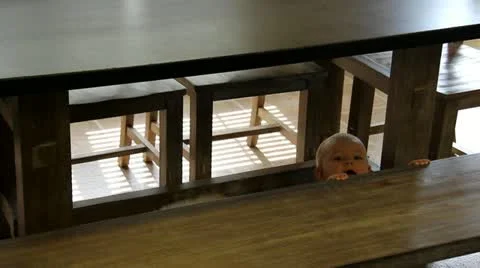 Baby Plays Under Table Stock Footage 11880515