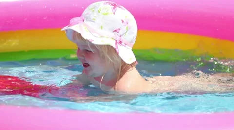 Baby in pool Stock Footage 7904783