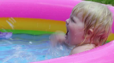 Baby in pool Stock Footage 7904985
