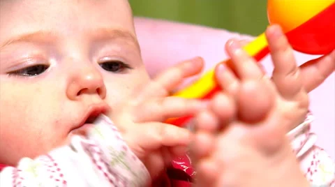Baby with rattle Stock Footage 981492