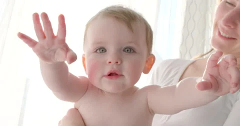 Baby reaching for camera Stock Footage 45705705
