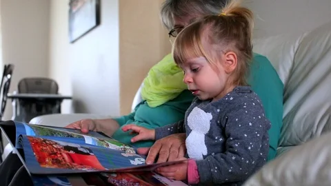 Baby read book Stock Footage 88419397