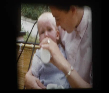 Baby refuses bottle from mom Stock Footage 33831314
