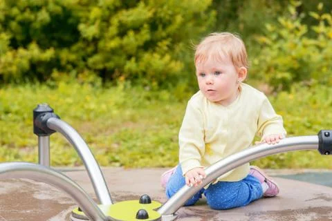 The baby is riding a carousel Stock Photos
