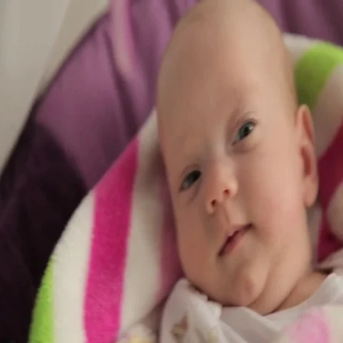 Baby rocking in a cradle Видео 69546836