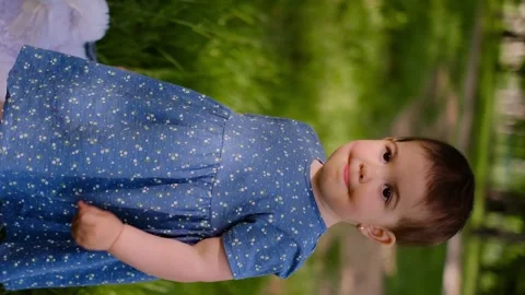 Baby run the first steps. kid running in lifestyle nature on the grass in park s Stock Footage 245361783