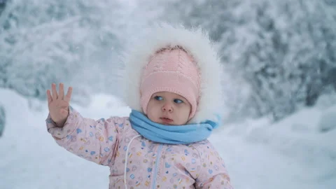 Baby sees snow for the first time Stock Footage 101641982
