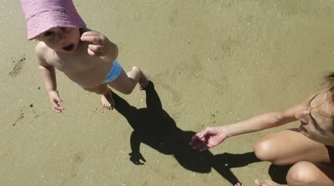 Baby showing seashell Stock Footage 58275566
