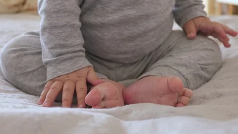 Baby Sitting on Soft Blanket Stock Footage 305512117